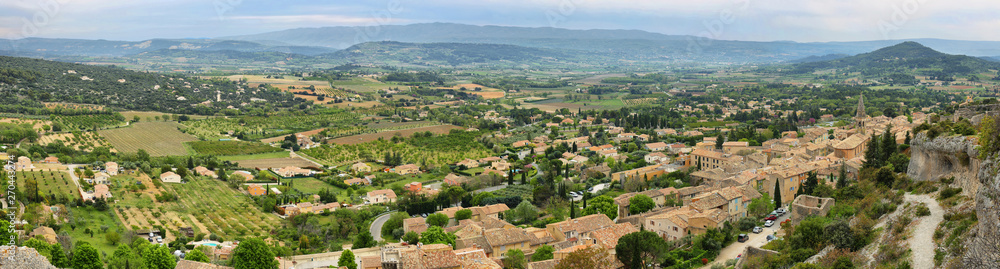 View of houses and surrounding fields in St Saturnin les Apt, France
