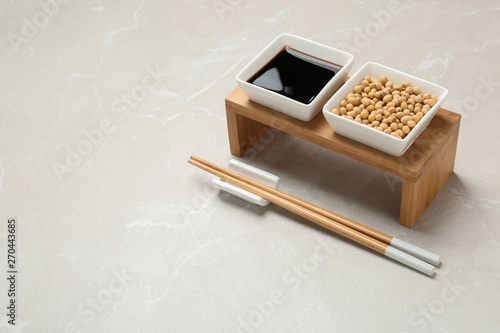 Dish of soy sauce served on table. Space for text
