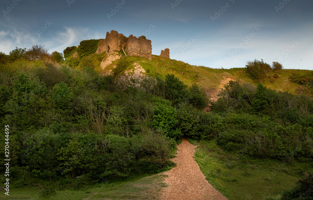 The remains of Pennard castle on the Gower peninsula, overlooking Three Cliffs Bay, Swansea, South Wales, UK