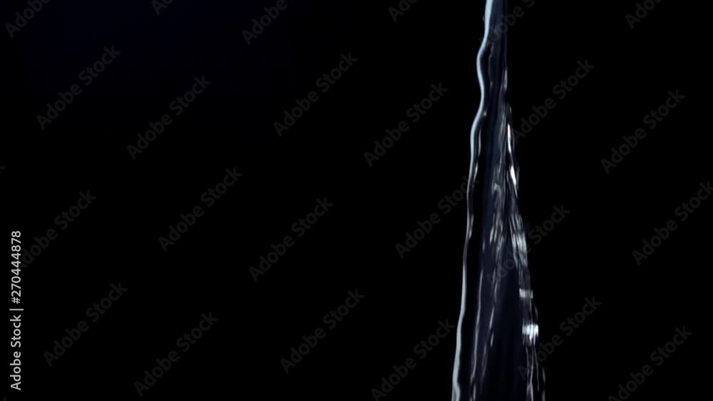 Water on a black background. Slow motion. Water on a black background. Slow motion.