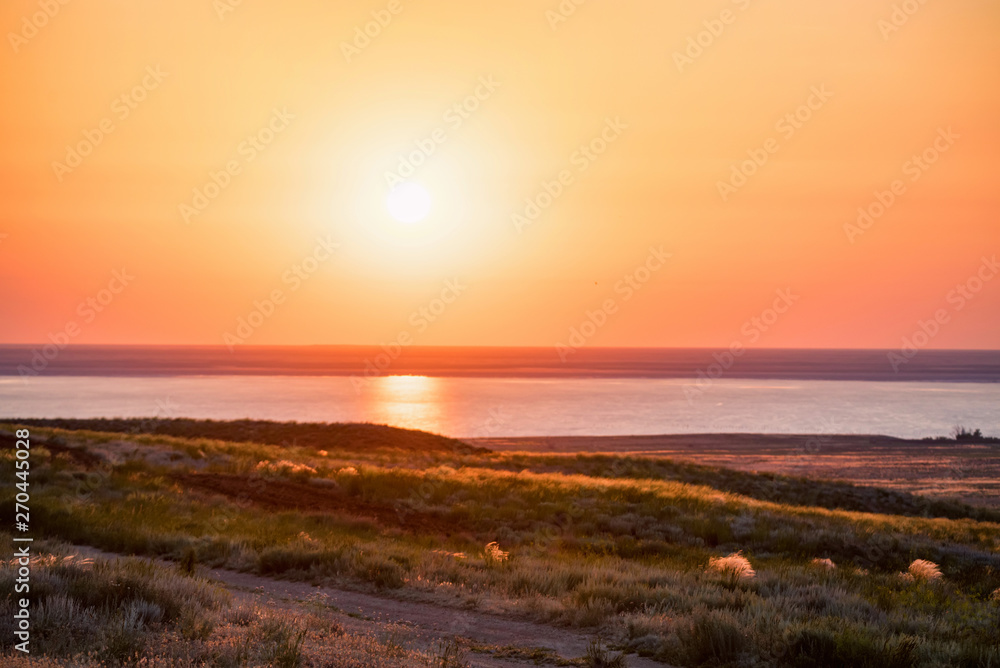Beautiful view of sunset at salt lake Baskunchak in Astrakhan region, Russia
