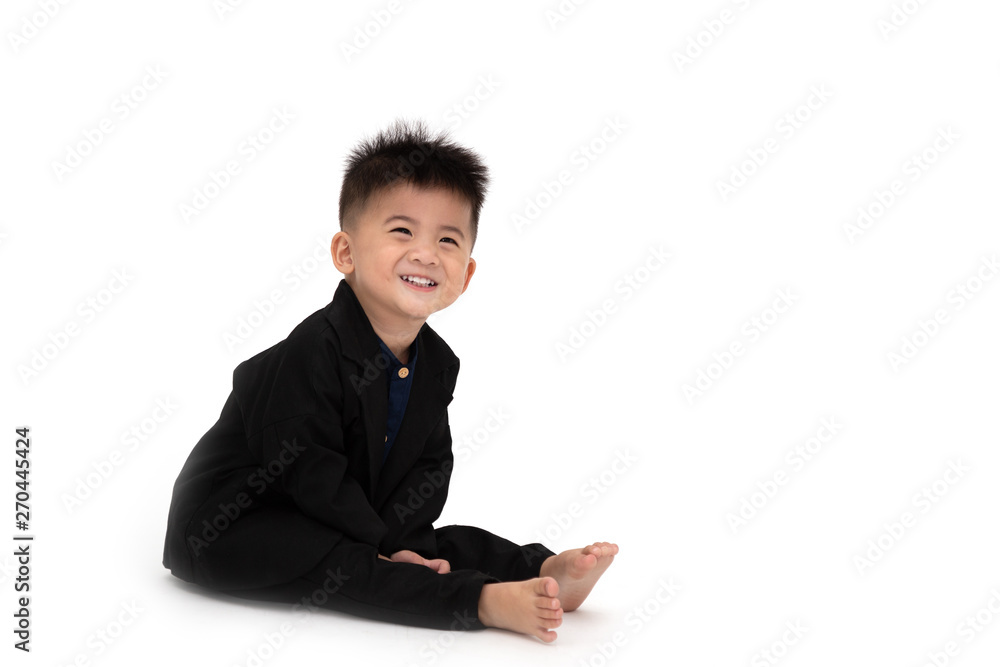Cute Asian boy wearing black suit isolated on white background Cute Asian boy wearing black suit isolated on white background