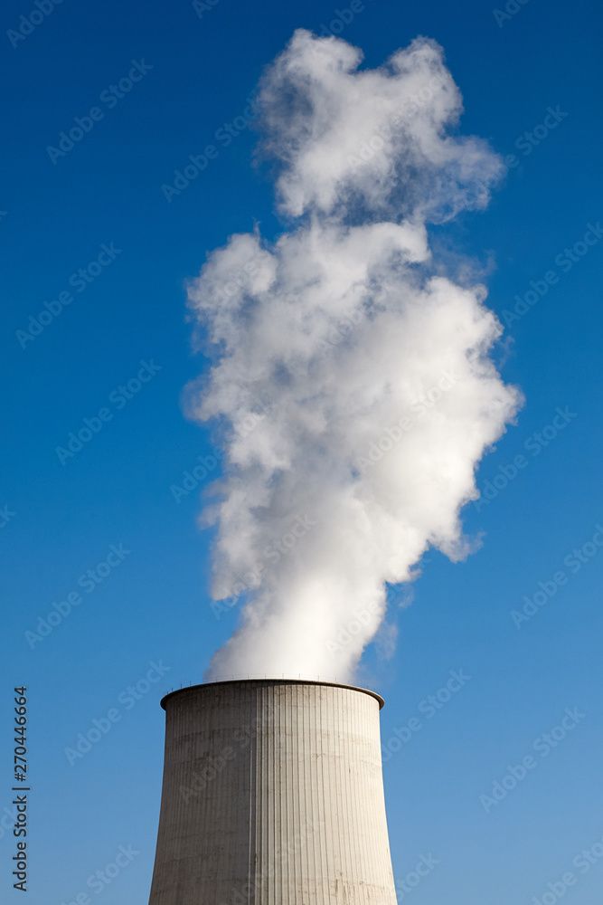 Smoking chimney against the blue sky, environmental pollution concept. Smoking chimney against the blue sky, environmental pollution concept.