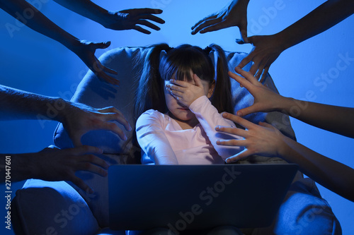 Obraz na płótnie Strangers reaching frightened little child with laptop on color background