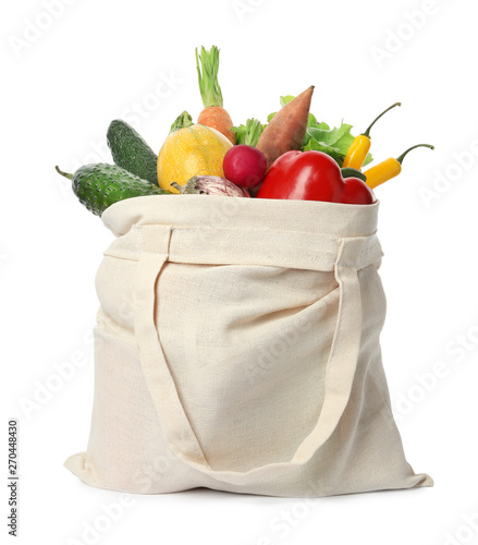 Fotografie Cloth bag with vegetables on white background
