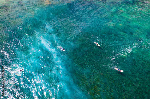 Aerial view of surfers on ocean and summer time 