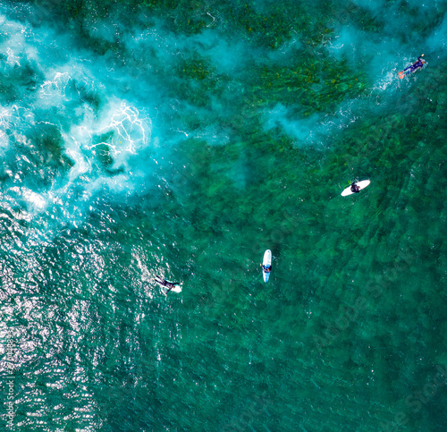 Aerial view of surfers on ocean and summer time 