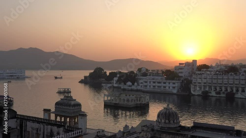 Wallpaper Mural Colorful sunset above architecture and lake water in Udaipur, Rajasthan, India, establishing shot. Udaipur is one of the most visited tourist destinations in India. Torontodigital.ca
