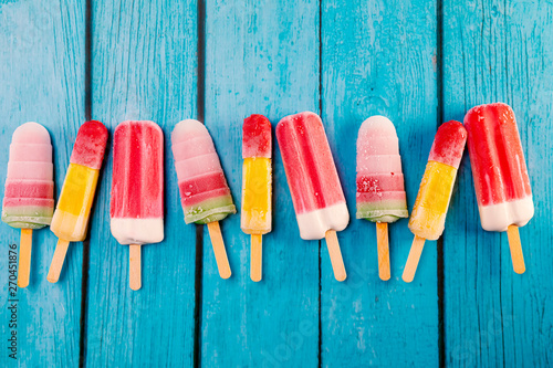 Ice cream stick placed on a blue vintage wooden