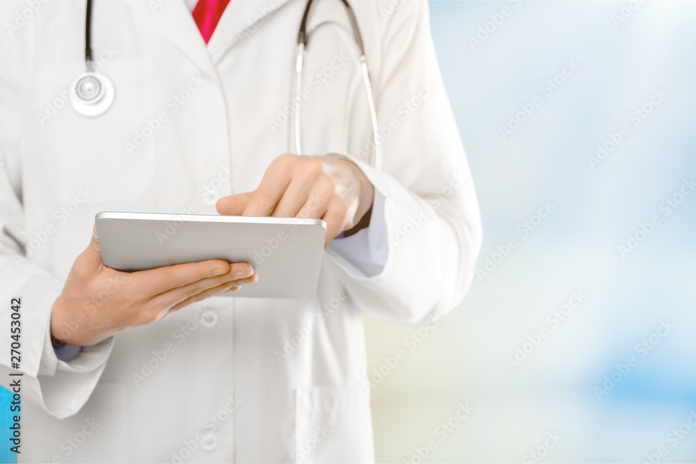 Close-up Doctor at hospital working with tablet pc Close-up Doctor at hospital working with tablet pc