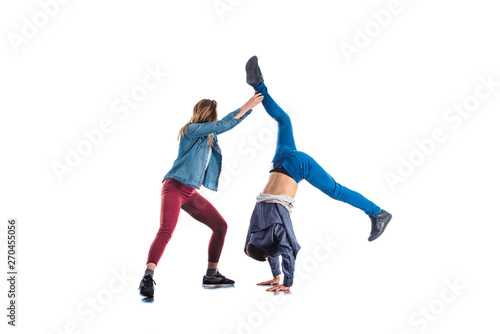 Two male and female exercise together handstand