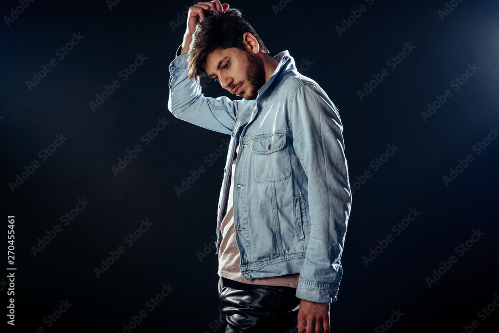 Attractive brunette male against black background Attractive brunette male against black background