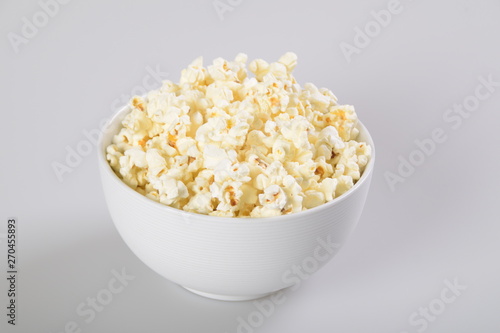Isolated Caramel popcorn in white bowl.