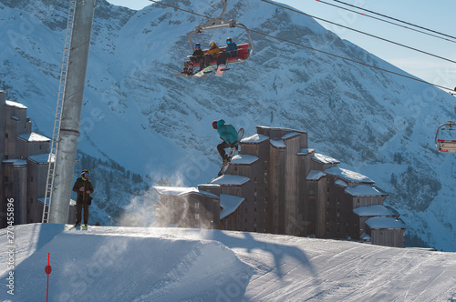 Photos A snowboarder hitting his jump off the kicker in the snowpark