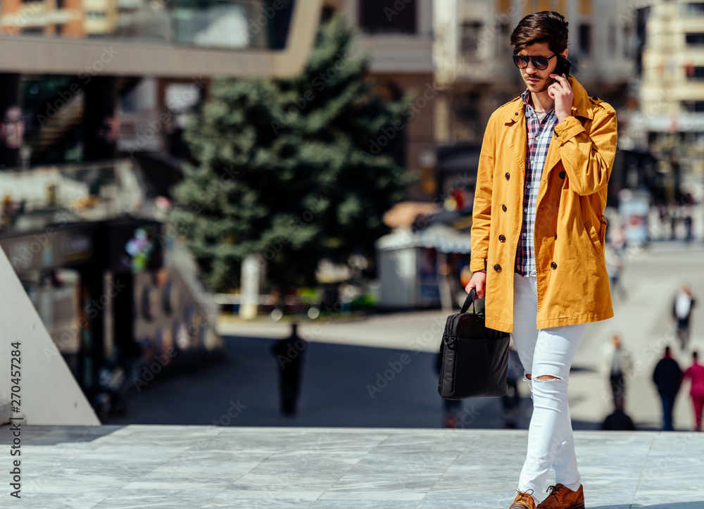 Modern businessman on mobile phone in urban place Modern businessman on mobile phone in urban place