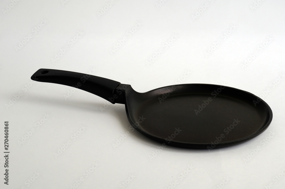 black fry pan over white background black fry pan over white background