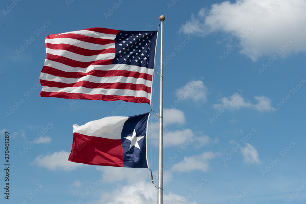 Fototapeta premium US flag and Texas flag flying
