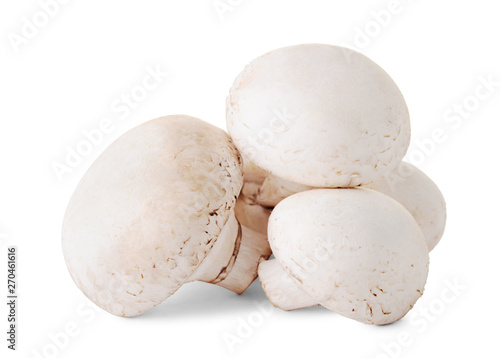 Group of fresh raw mushrooms (champignons) isolated on white background