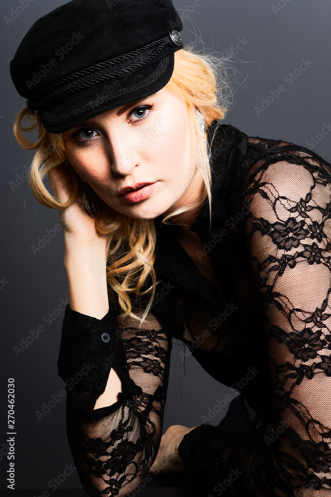 Portrait of an attractive woman, shot in the studio against a grey background Portrait of an attractive woman, shot in the studio against a grey background