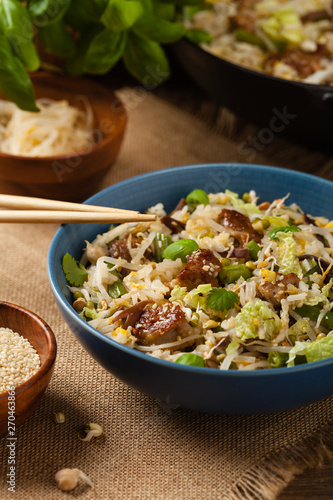 Fried veal, with rice, Chinese cabbage and mushrooms. Sprinkled with sesame and soy sauce.