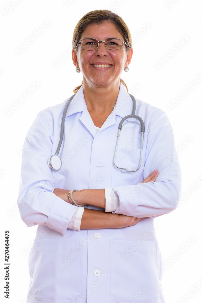Studio shot of mature happy woman doctor smiling while wearing e Studio shot of mature happy woman doctor smiling while wearing e