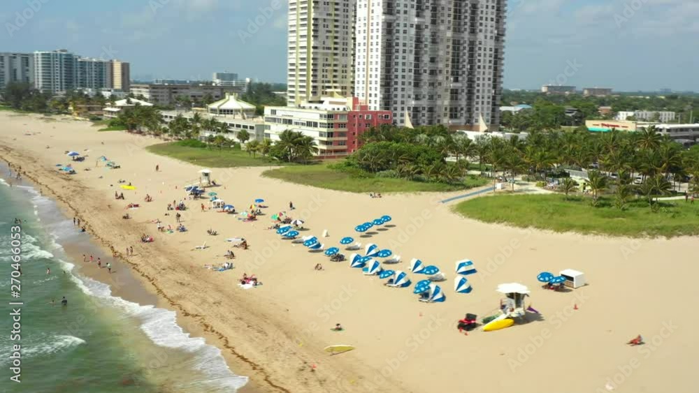Aerial tourists umbrellas on the beach Aerial tourists umbrellas on the beach