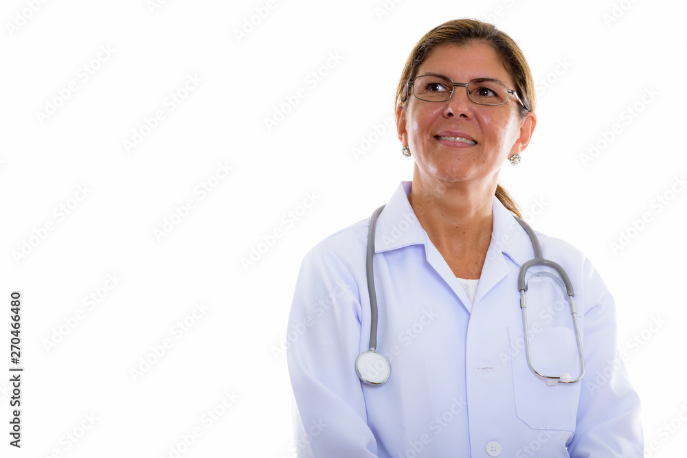 Studio shot of mature beautiful woman doctor thinking while look