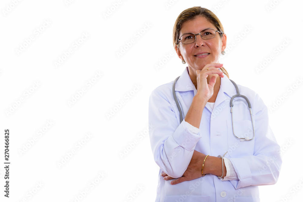 Studio shot of mature beautiful woman doctor thinking Studio shot of mature beautiful woman doctor thinking