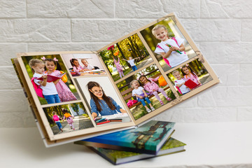 High angle view open book with album at home
