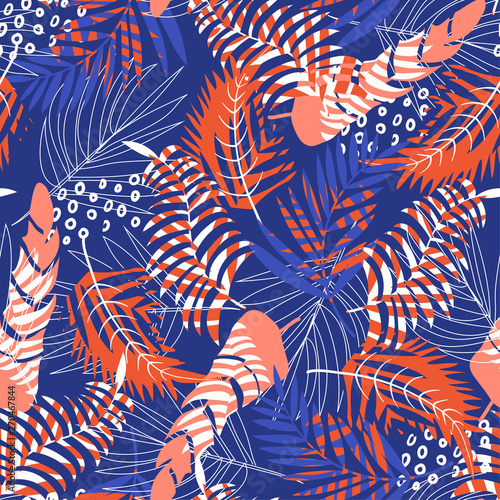 Bright seamless pattern with tropical plants on blue background. Vector design. Jungle print. Textiles and printing.