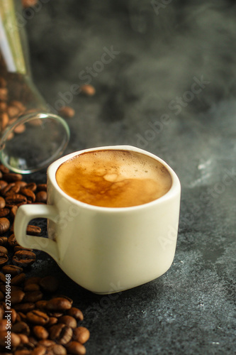 coffee and coffee beans (hot flavor drink) aperitif. food background. top