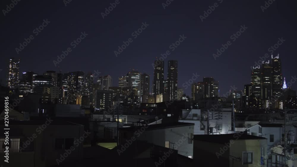 Shinjuku skyline and rooftops in Tokyo, Japan - Wide Static Night shot Shinjuku skyline and rooftops in Tokyo, Japan - Wide Static Night shot