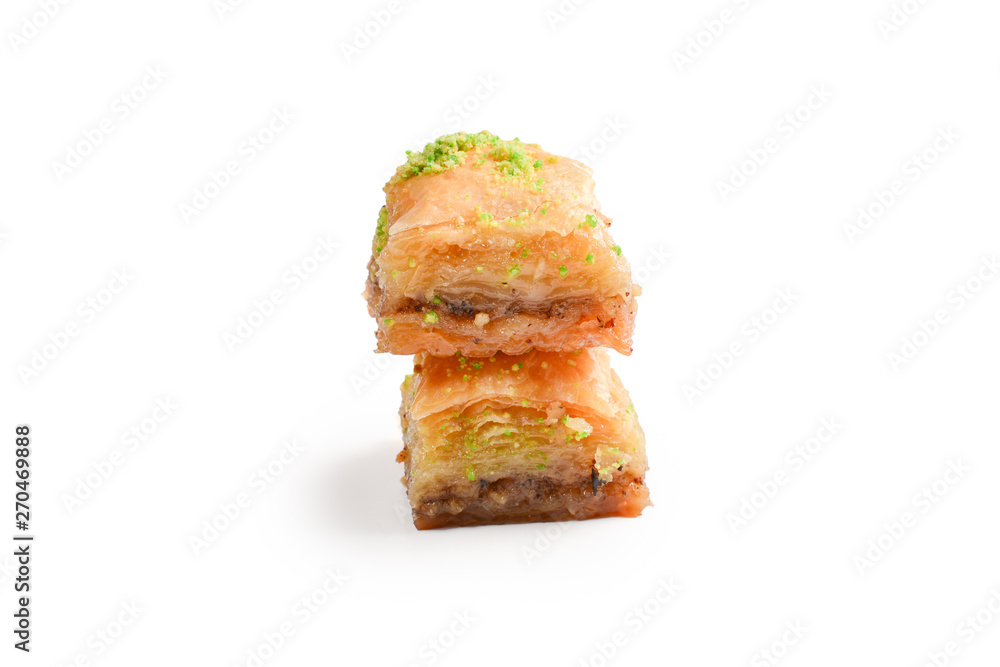 Pistachio baklava on a white background. Dessert. Pistachio baklava on a white background. Dessert.