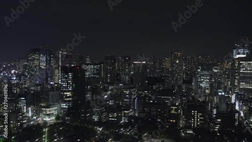 Wide Static Night shot of Minato city skyline in Tokyo, Japan from Tokyo Tower photo