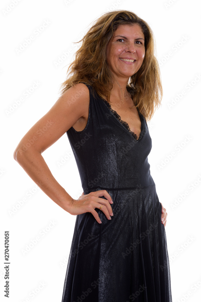 Studio shot of mature happy woman smiling and posing Studio shot of mature happy woman smiling and posing
