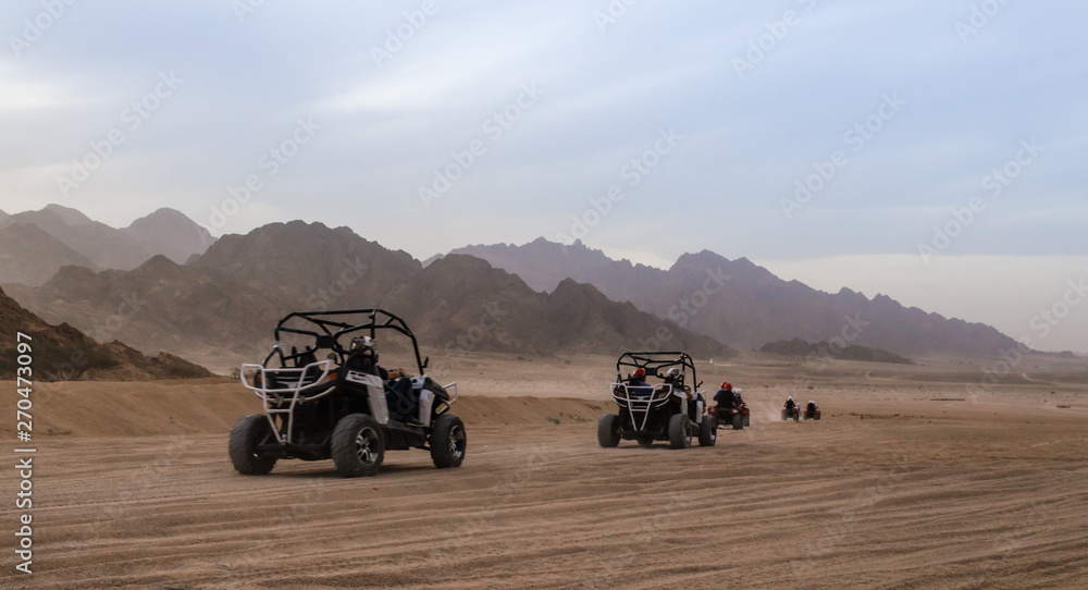 trip of tourists to the desert on the offroad buggy in Egypt trip of tourists to the desert on the offroad buggy in Egypt