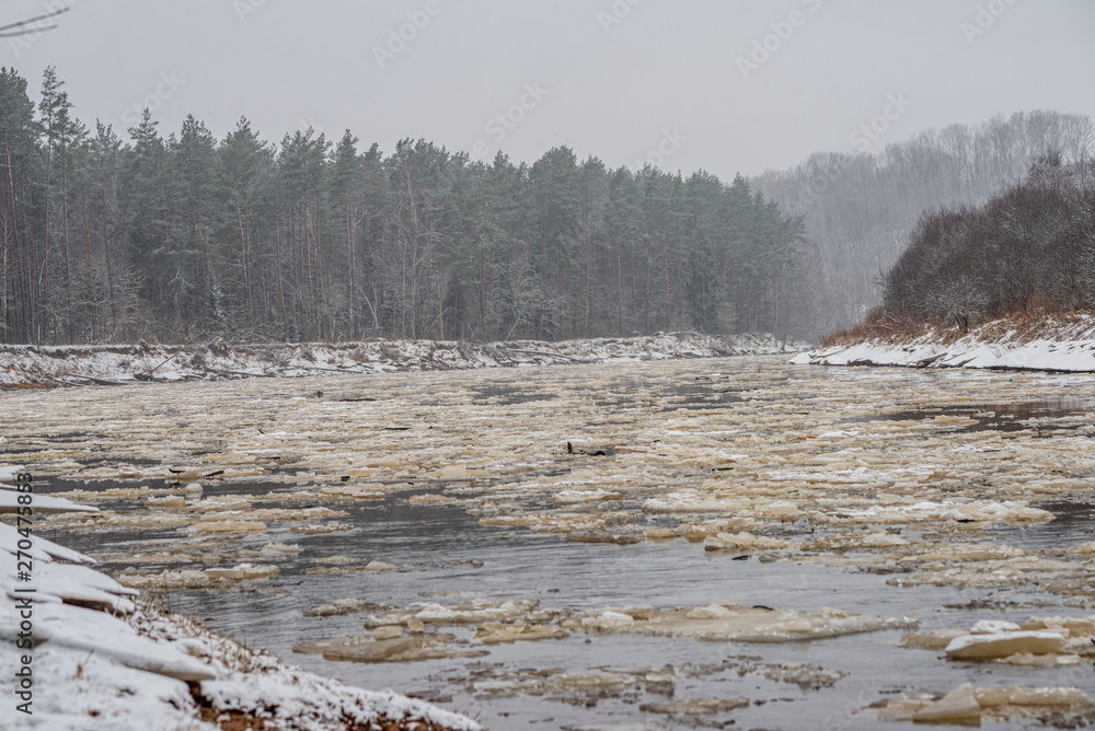 frozen river in winter countryside