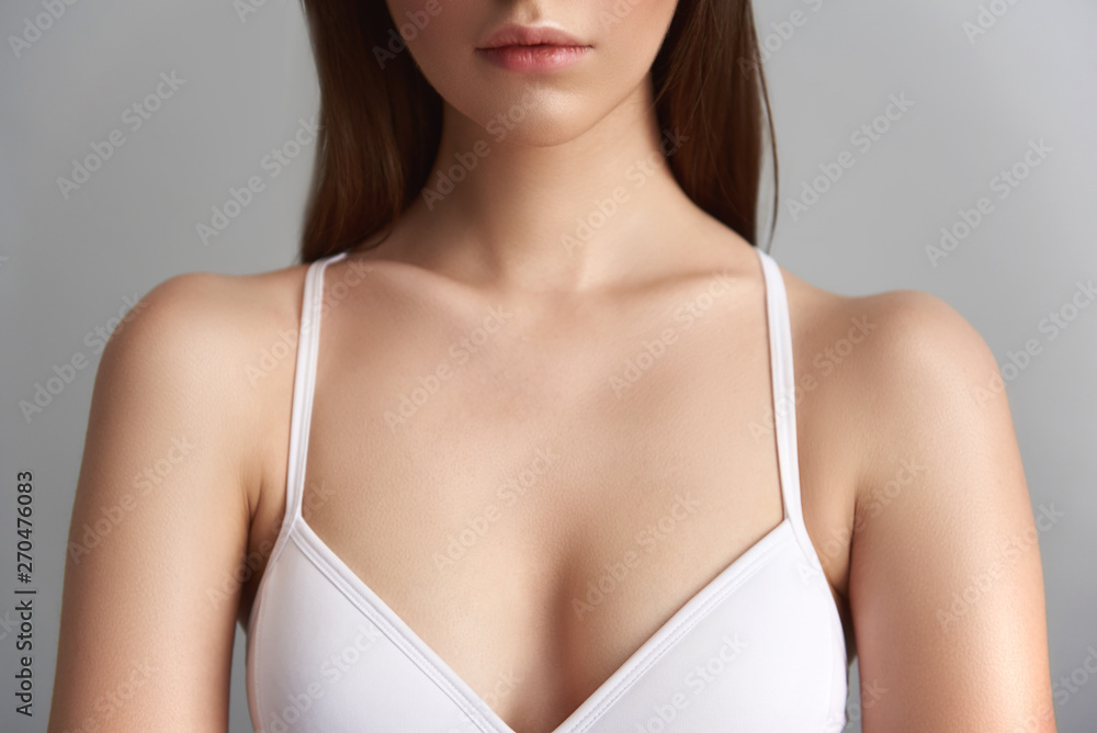 Beautiful lady in bra isolated on grey background Beautiful lady in bra isolated on grey background