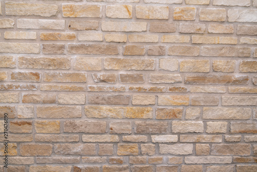 Stacked stone wall background horizontal clear brown sand