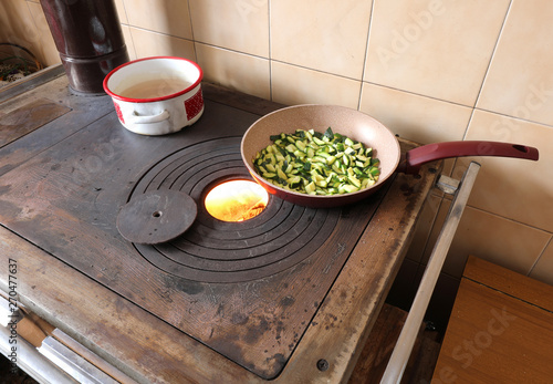 zucchini cooked in a pan on a stove photo