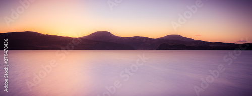 Isle of Skye landscape - sunset over ocean and mountains