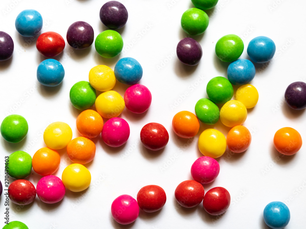 Top view of colorful candies on white background. Top view of colorful candies on white background.