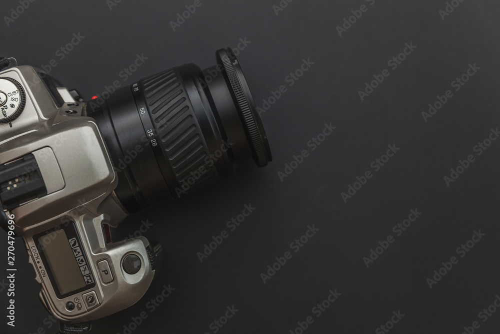 Photographer workplace with dslr camera system on dark black table background. Hobby travel photography concept. Flat lay top view copy space Photographer workplace with dslr camera system on dark black table background. Hobby travel photography concept. Flat lay top view copy space