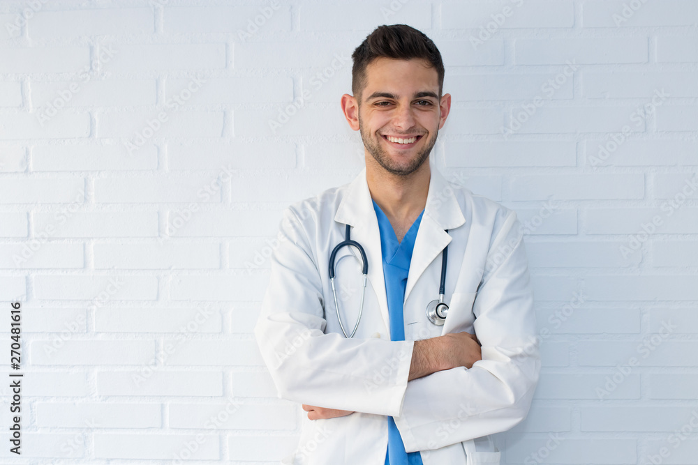 portrait of young doctor smiling on white background portrait of young doctor smiling on white background