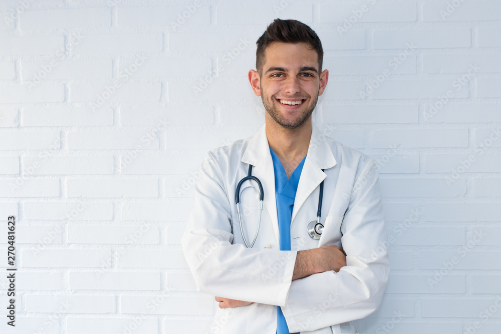 portrait of young doctor smiling on white background portrait of young doctor smiling on white background
