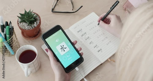 woman using foreign language learn chinese mobile phone app