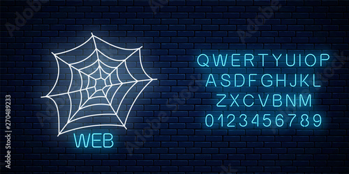 Glowing neon sign of spyder web banner design with alphabet. Bright halloween night scary sign neon style photo