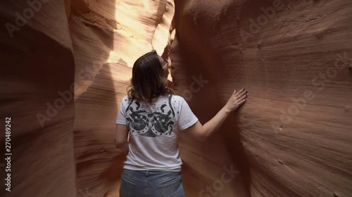 Sandy rocky canyon of Antelope, woman walking
