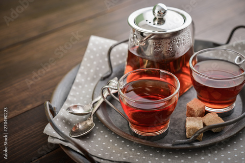 Two glass cup of tea with teapot photo