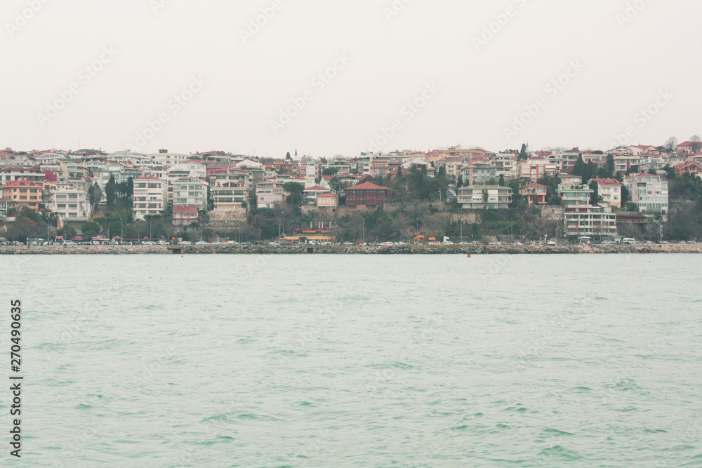 Cityscape of Üsküdar neighborhood on the asian side of Istanbul, Turkey in Gloomy and sad weather